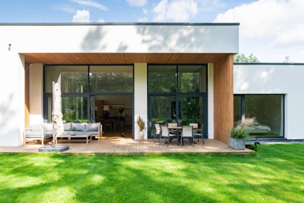 Backyard with green lawn of a modern private house.