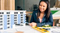 smiling-african-american-woman-showing-model-building